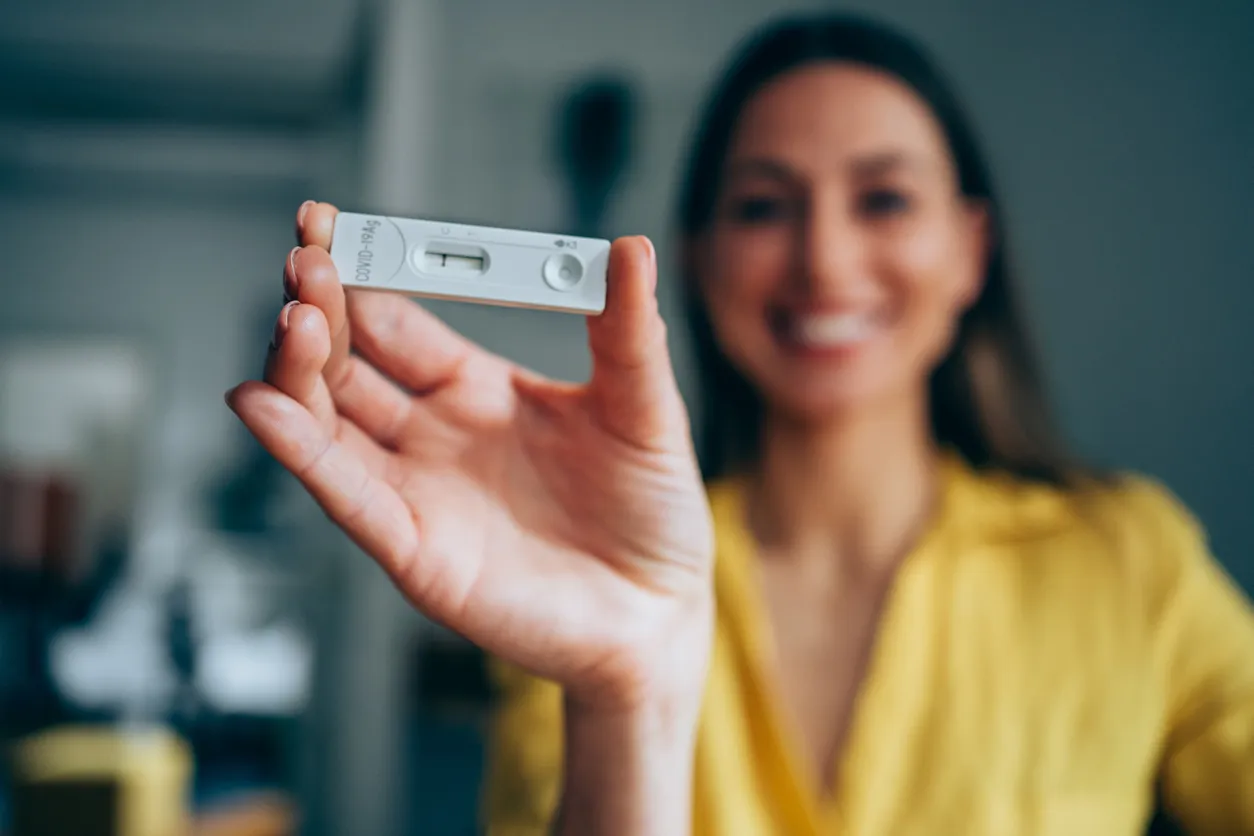 Woman holding Covid-19 rapid test
