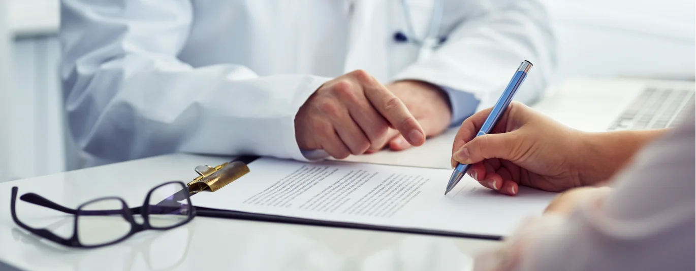 People writing on a document