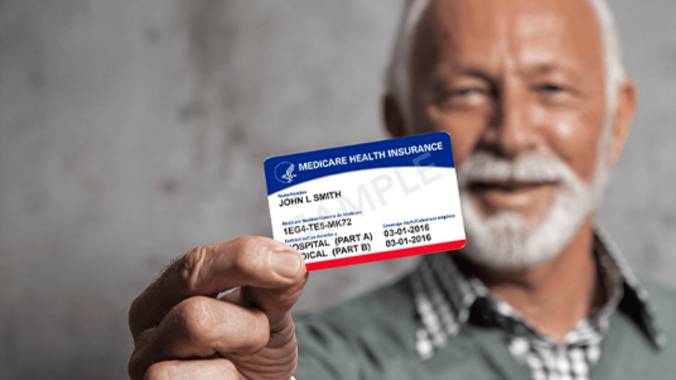 Old man holding his Medicare identification card