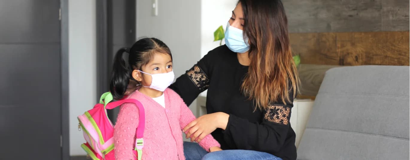 Mother and child wearing masks
