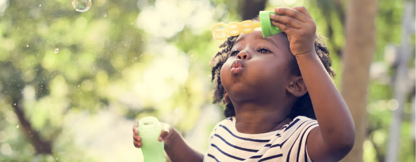 Child blowing bubbles