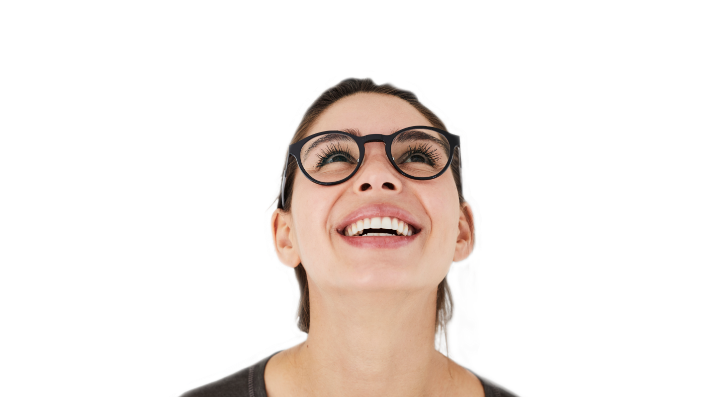 Carefree girl in spectacles, looking up and smiling