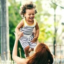 Person throwing a child up in the air