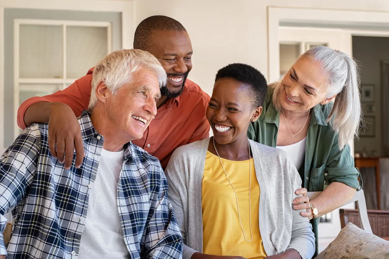 Four people sitting on a porch